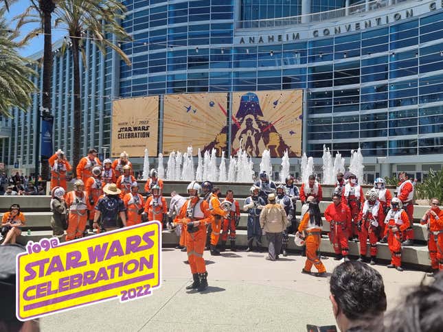 Cosplayers dressed as Rebel pilots in front of the convention center for Star Wars Celebration 2022.