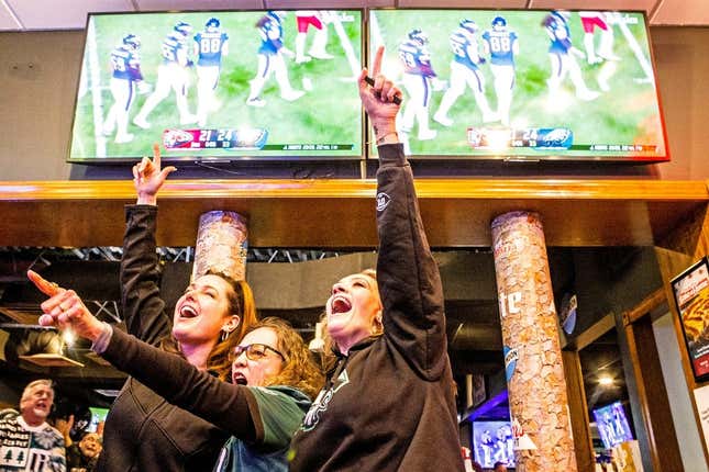 From left, Philadelphia Eagles fans Jennifer Sult, Wanda Paris and Stephanie Napier hug in celebration of a touchdown during a watch party for the Eagles vs. Kansas City Chiefs Super Bowl LVII game at Grotto Pizza in Wilmington, Sunday, Feb. 12, 2023.

P4wil Super Bowl 021223