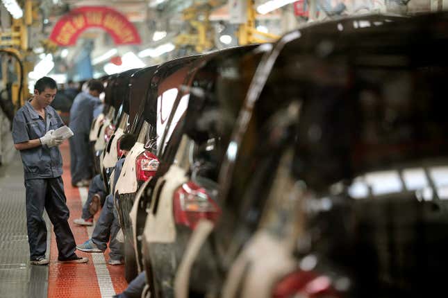 Workers assemble cars at the manufacturing base of Chinese automaker Geely in Cixi, China.