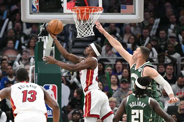 Apr 26, 2023; Milwaukee, Wisconsin, USA; Miami Heat forward Jimmy Butler (22) shoots the ball against Milwaukee Bucks center Brook Lopez (11)during game five of the 2023 NBA Playoffs at Fiserv Forum.