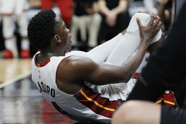 Apr 22, 2023; Miami, Florida, USA; Miami Heat guard Victor Oladipo (4) reacts after getting injured in the fourth quarter against the Milwaukee Bucks during game three of the 2023 NBA Playoffs at Kaseya Center.