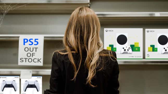 An image of a woman shopping in a department store, with the shelves mostly barren save for PlayStation 5 controllers on the left and Xbox Series S consoles on the right.
