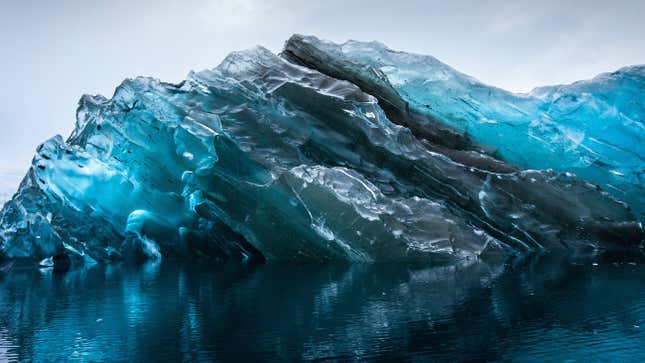 The glassy blue glow of a flipped iceberg.