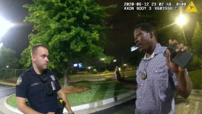 This screen grab taken from body camera video provided by the Atlanta Police Department shows Rayshard Brooks, right, as he speaks with Officer Garrett Rolfe, left, in the parking lot of a Wendy’s restaurant in Atlanta, June 12, 2020. A specially appointed prosecutor said Tuesday, Aug. 23, 2022, that he will not pursue any charges against the Atlanta police officer who fatally shot Brooks more than two years ago.