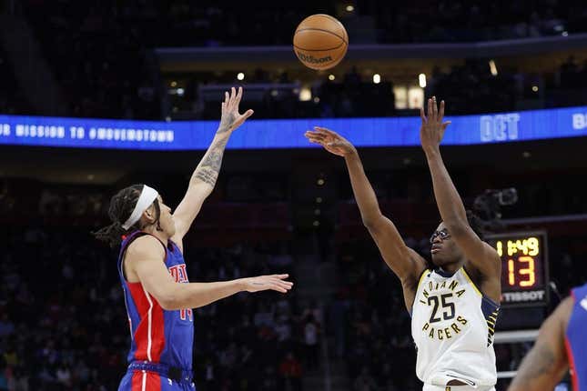 Mar 11, 2023; Detroit, Michigan, USA;  Indiana Pacers forward Jalen Smith (25) shoots the ball against Detroit Pistons guard R.J. Hampton (14) in the second half at Little Caesars Arena.