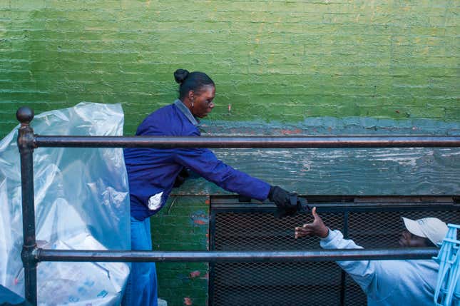 Volunteers are cleaning trash at looted businesses