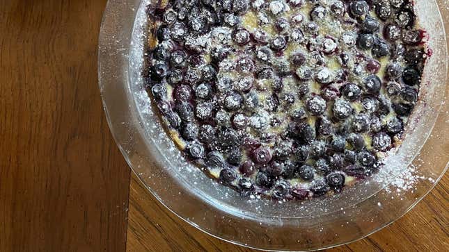 Overhead view of blueberry clafouti on wooden table