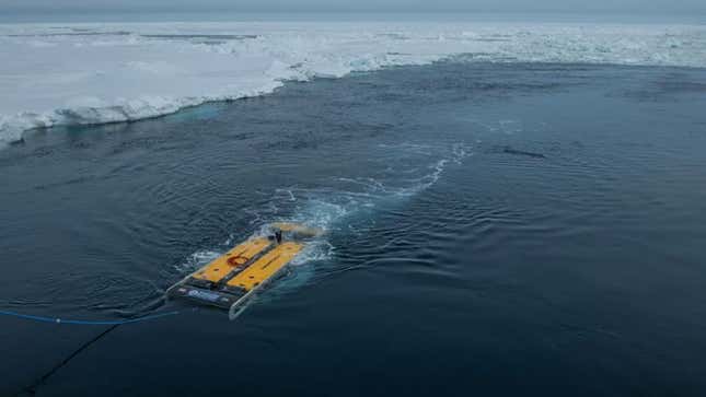 A photo of a Saab submarine floating on icy water. 