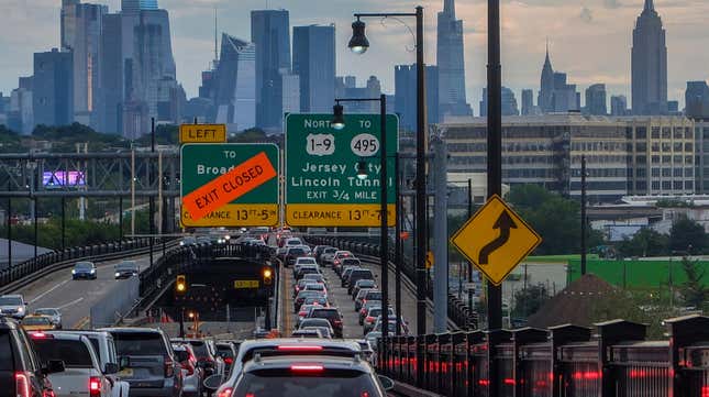 The Empire State Building and Tourist District are seen while Traffic jam is reported along the route to New York City on August 17, 2022, in Jersey City, New Jersey. New York Governor. Kathy Hochul is proposing a congestion pricing plan to raise billions of dollars in revenue for public transit projects and also decreasing traffic jam in Manhattans tourism district and financial center.