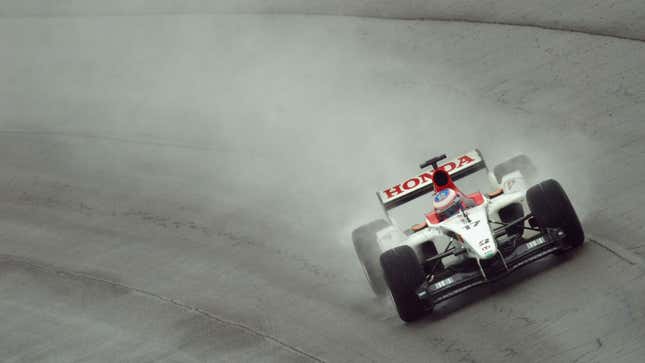 Jenson Button driving the BAR Honda F1 car at a wet US Grand Prix. 