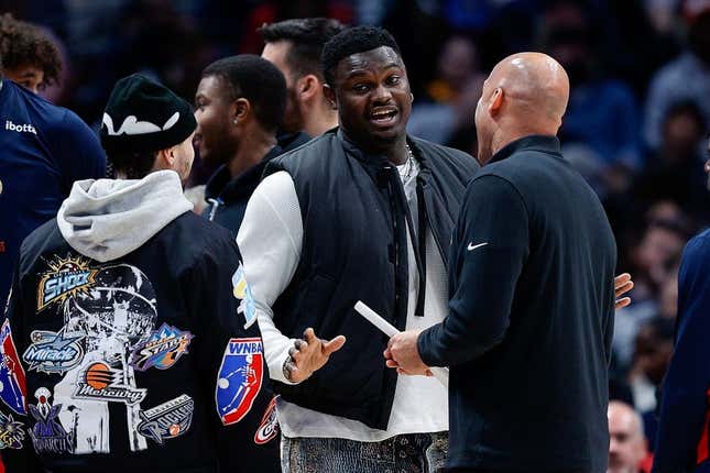 Mar 30, 2023; Denver, Colorado, USA; New Orleans Pelicans forward Zion Williamson (C) talks with guard Jose Alvarado (L) and assistant coach Fred Vinson (R) in the second quarter against the Denver Nuggets at Ball Arena.