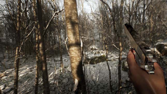 A screenshot of Abandoned depicting the protagonist holding a pistol while walking through a snow-covered forest.