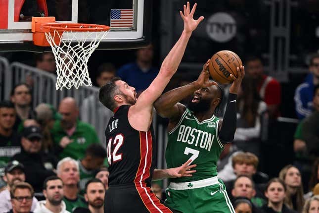 May 25, 2023; Boston, Massachusetts, USA; Boston Celtics guard Jaylen Brown (7) shoots against Miami Heat forward Kevin Love (42) in the fourth quarter during game five of the Eastern Conference Finals for the 2023 NBA playoffs at TD Garden.