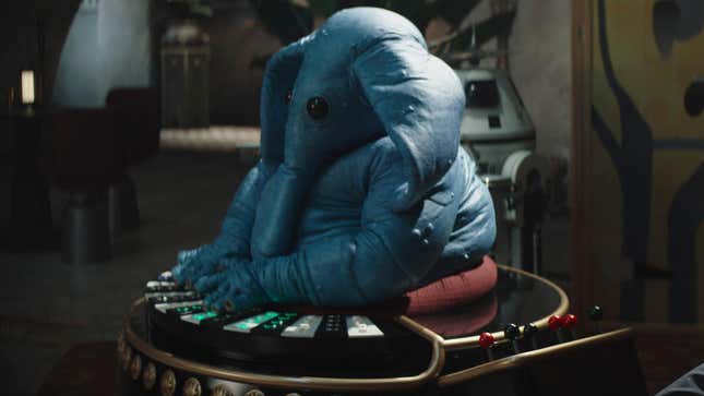 Max Rebo, the small blue Ortolan from Jabba's palace band, plays his organ in his current position at Garsa Fwip's Sanctuary.