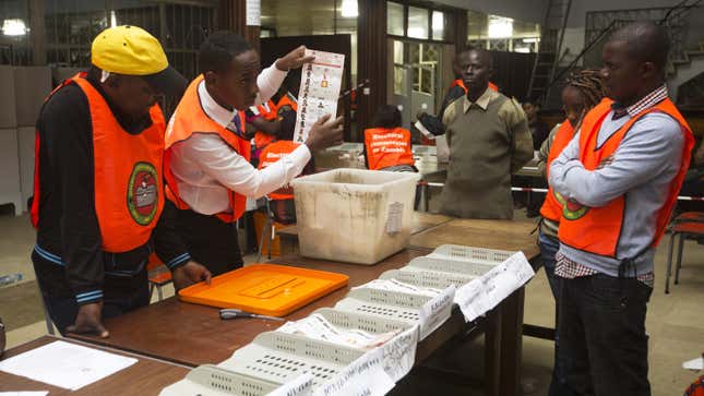 Election officials count ballot papers at a voting station in Lusaka, Zambia Jan. 20, 2015.
