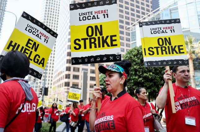 Hospitality workers picket outside a cluster of major hotels in Los Angeles, days before the July Fourth holiday.