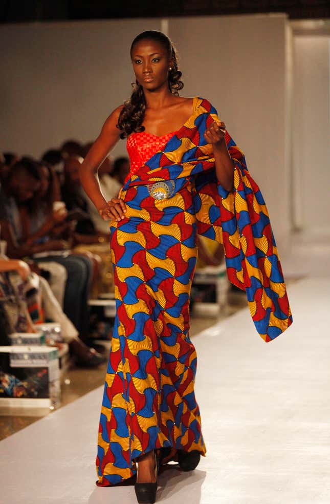 A model displays an outfit by designer Kil Fashion in Lagos
