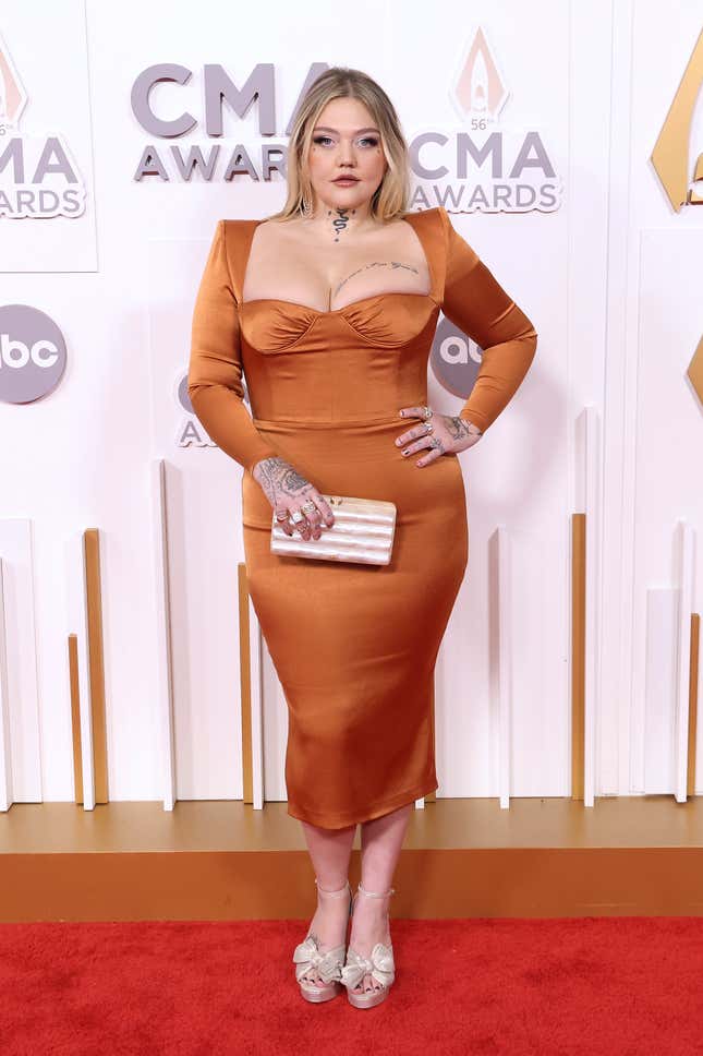 Image for article titled 2022 CMAs Red Carpet: Katy Perry Wears Stupid Denim Jumpsuit With Giant Bow, Etc.