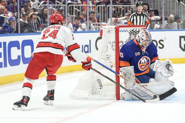 Apr 28, 2023; Elmont, New York, USA; New York Islanders goaltender Ilya Sorokin (30) makes a save against Carolina Hurricanes center Seth Jarvis (24) in game six of the first round of the 2023 Stanley Cup Playoffs at UBS Arena.