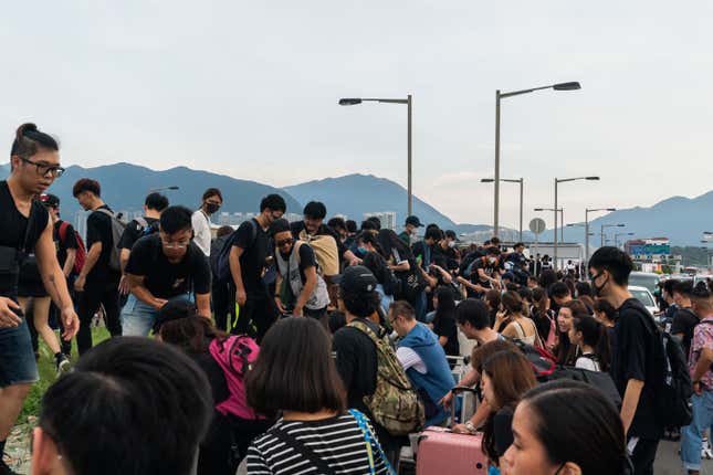 Protesters and travelers make their way to Hong Kong International Airport on Aug. 12, 2019 in Hong Kong.