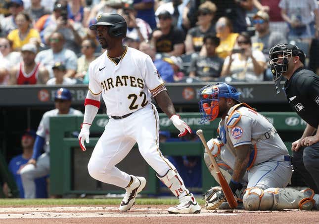 Jun 11, 2023; Pittsburgh, Pennsylvania, USA; Pittsburgh Pirates designated hitter Andrew McCutchen (22) hits a single to register his 2000th career major league hit during the first inning against the New York Mets at PNC Park.