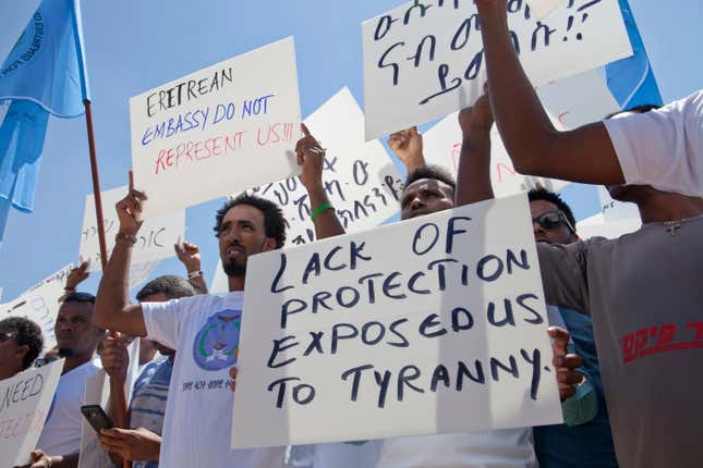 File - In this Monday, June 25, 2018, file photo, Eritrean asylum seekers hold a rally in front of Israeli Ministry of Foreign Affairs in Jerusalem. The startling and sudden thaw between longtime enemies Eritrea and Ethiopia is opening up a world of possibilities for the countries' residents: new economic and diplomatic ties, telephone and transport links and the end to one of the most bitter feuds between neighbors. But the fledgling peace is raising new questions for Eritrea's diaspora, tens of thousands of people who fled the Eritrean government's tight grip, a rigid compulsory military and endemic poverty who are cautiously waiting to see how the truce will shape their homeland and perhaps offer them a chance to return.