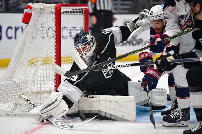 Mar 16, 2023; Los Angeles, California, USA; Los Angeles Kings goaltender Pheonix Copley (29) blocks a shot as Columbus Blue Jackets center Boone Jenner (38) moves in for the rebound during the first period at Crypto.com Arena.