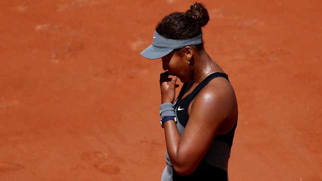 Naomi Osaka reacts during her first round match against Romania's Patricia Maria Tig at the 2021 French Open