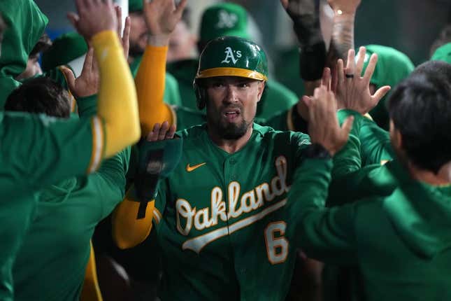 Apr 24, 2023; Anaheim, California, USA; Oakland Athletics third baseman Jace Peterson (6) celebrates after scoring in the 10th inning against the Los Angeles Angels at Angel Stadium.