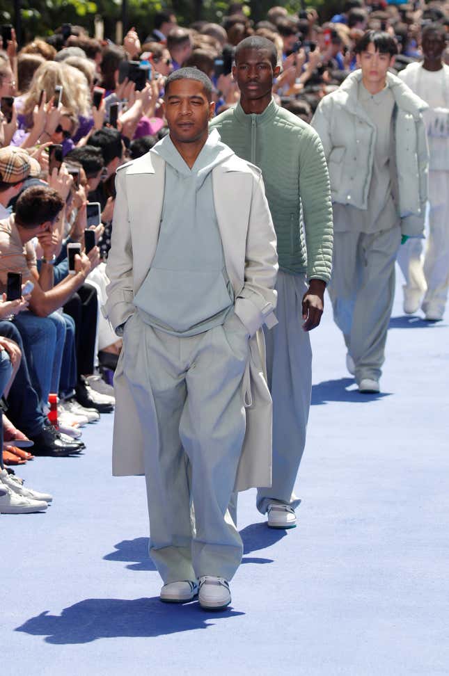 Kid Cudi presents a creation by designer Virgil Abloh as part of his Spring/Summer 2019 collection for Louis Vuitton fashion house during Men's Fashion Week in Paris, France, June 21, 2018. REUTERS/Charles Platiau - RC1BEB85D3D0