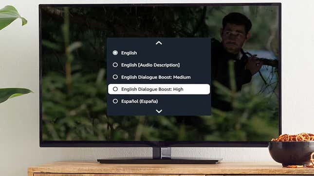 A screenshot of a TV displaying a Prime Video program with a pop-up overlay offering Dialogue Boost options, including "English, English [Audio Description], English Dialogue Boost: Medium, and English Dialogue Boost: High