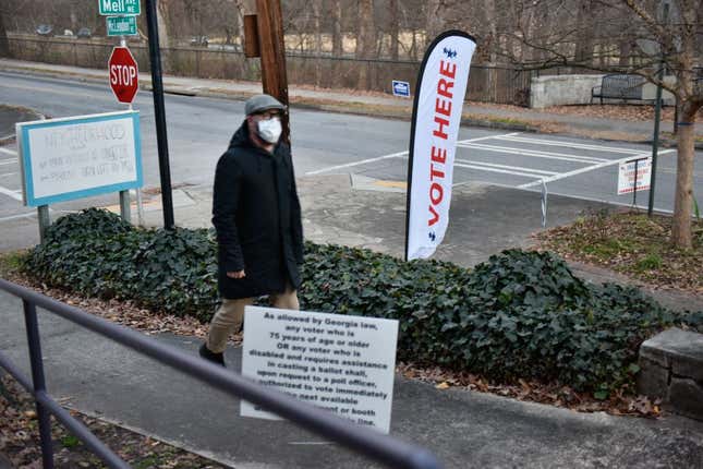 A man into the Neighborhood Church polling station in Candler Park, Atlanta, Georgia, during the Georgia Senate runoff elections on January 5, 2021. 