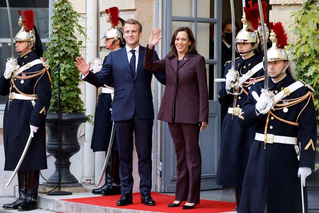 France’s President Emmanuel Macron welcomes US Vice-President Kamala Harris (R) upon arrival for the International conference on Libya at the Maison de la Chimie in Paris on November 12, 2021. 