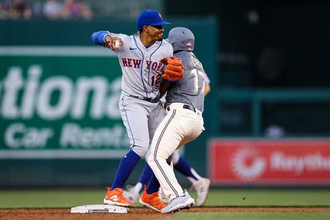 May 12, 2023; Washington, District of Columbia, USA; New York Mets shortstop Francisco Lindor (12) retires Washington Nationals center fielder Alex Call (17) while turning a double play during the second inning at Nationals Park.