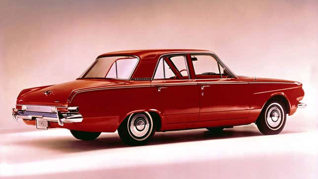 A photo of a red Plymouth Valiant sedan. 