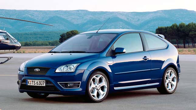 A photo of a blue Ford Focus hatchback. 