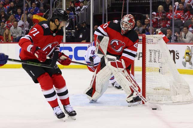 Apr 27, 2023; Newark, New Jersey, USA; New Jersey Devils goaltender Akira Schmid (40) clears the puck against the New York Rangers during the first period in game five of the first round of the 2023 Stanley Cup Playoffs at Prudential Center.