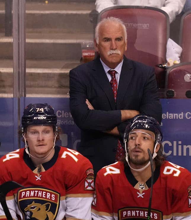Oct 16, 2021; Sunrise, Florida, USA; Florida Panthers head coach Joel Quenneville watches the game behind right wing Owen Tippett (74) and left wing Ryan Lomberg (94) during the third period against the New York Islanders at FLA Live Arena.