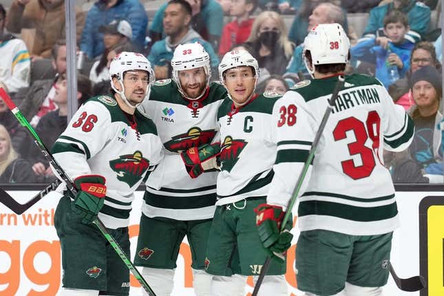 Mar 11, 2023; San Jose, California, USA; Minnesota Wild defenseman Jared Spurgeon (third from left) celebrates with right wing Mats Zuccarello (36) and defenseman Alex Goligoski (33) and right wing Ryan Hartman (38) after scoring a goal against the San Jose Sharks during the first period at SAP Center at San Jose.