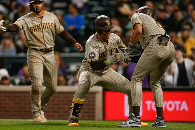 Aug 1, 2023; Denver, Colorado, USA; San Diego Padres left fielder Juan Soto (22) celebrates his three run home run with right fielder Fernando Tatis Jr. (23) in the fifth inning against the Colorado Rockies at Coors Field.