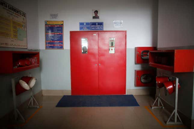 A newly installed fire door is seen in a factory of Ananta Garments Ltd in Savar June 10, 2014.