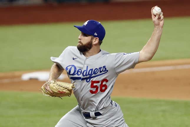 Oct 14, 2020; Arlington, Texas, USA; Los Angeles Dodgers relief pitcher Adam Kolarek (56) throws against the Atlanta Braves during the ninth inning of game three of the 2020 NLCS at Globe Life Field.