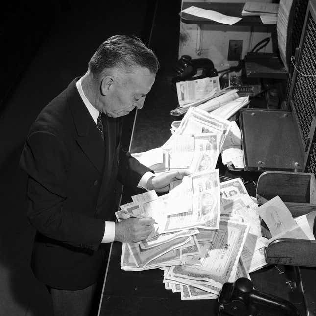 New York Club Exchange Securities A.A. Callaghan, teller in the Clearing Corporation is preparing stock certificates for final delivery in New York, Sept. 6, 1947.