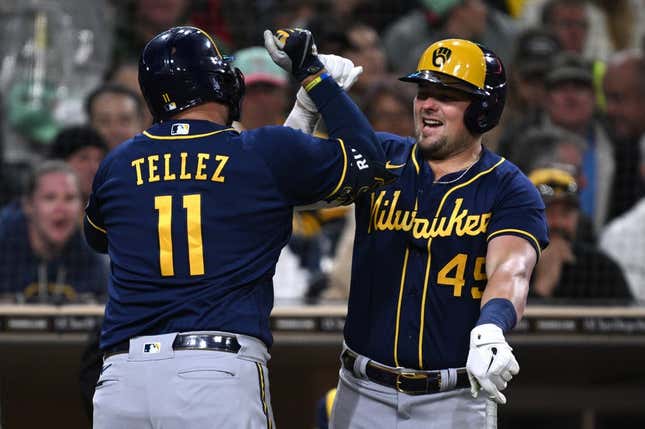 Apr 14, 2023; San Diego, California, USA; Milwaukee Brewers first baseman hitter Rowdy Tellez (11) is congratulated by designated hitter Luke Voit (45) after hitting a home run against the San Diego Padres during the fourth inning at Petco Park.