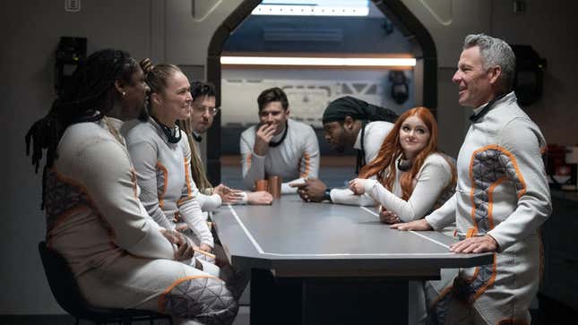 The cast of the reality show on set at the simulated Martian environment. 