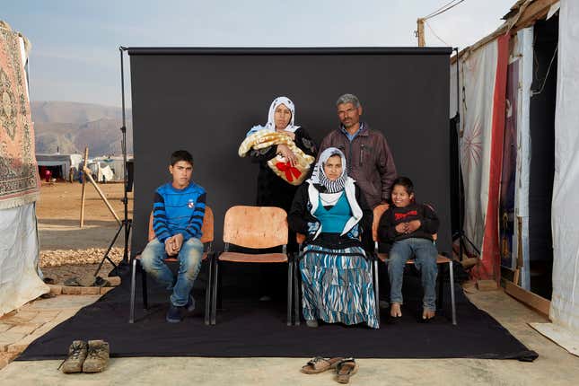 Image for article titled These striking family portraits show the lost members of Syrian refugee families