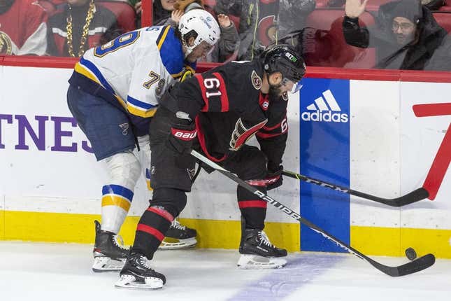 Feb 19, 2023; Ottawa, Ontario, CAN; St. Louis Blues left wing Sammy Blais (79) fights for the puck against Ottawa Senators center Derick Brassard (61) in the third period at the Canadian Tire Centre.
