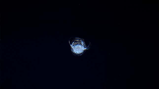 This chip in the window of the International Space Station was caused by orbital debris.