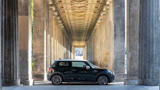 A photo of a black electric Mini parked in a tunnel. 