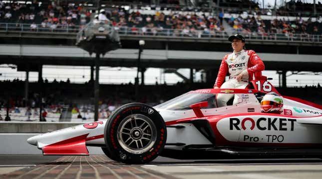 Simona de Silvestro poses with her Paretta Autosport car after qualifying for the Indy 500